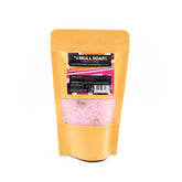 Kraft display bag with window containing sensual pink Scottish rose and patchouli bath salts with rose petals in.  handmade in Tobermory by the Isle of Mull soap co.